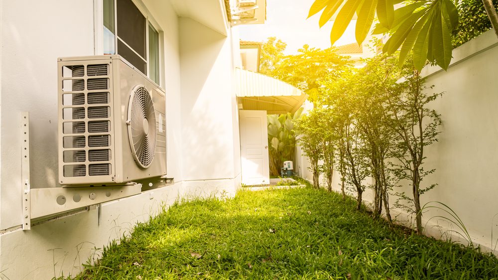 Central AC condenser unit outside the house