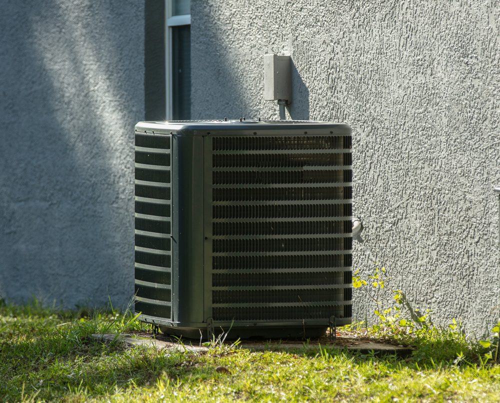Residential central AC condenser unit, serviced and running