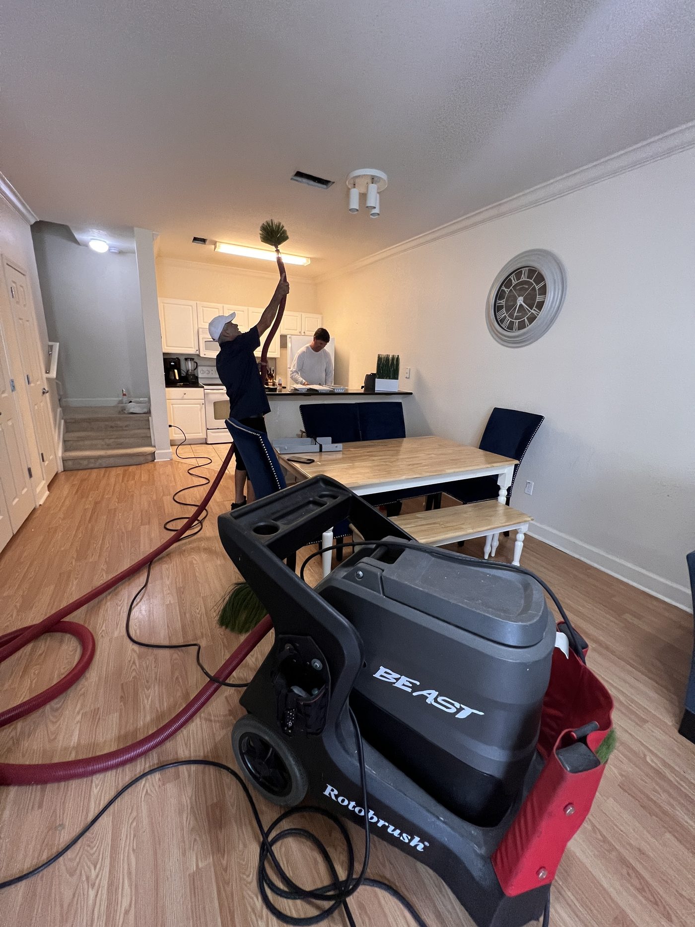 Technician cleaning ductwork
